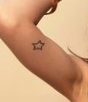 Lily Maymac Tattoo on right hand muscle