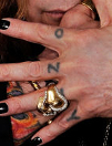 Ozzy Osbourne Tattoo on fingers