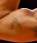 Trae Young Tattoo on muscle