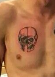 Jamie Campbell Bower Tattoo on chest