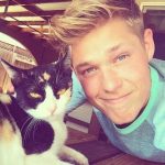 Mason Dye with his pet cat