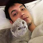 Paolo Ballesteros with his pet cat