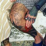 Aaron Chalmers's right leg tattoos