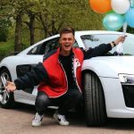 Caspar Lee with his Audi R8 car