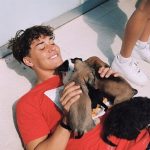 Noah Beck with his pet dogs