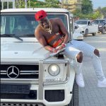 Abisi Emmanuel with his Mercedes G-wagon Car