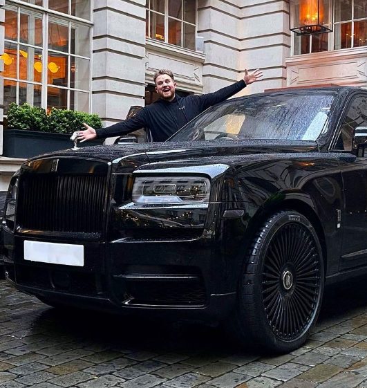 Ben Phillips with his Rolls Royal Car