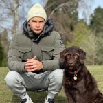Chris Hughes with his pet dog