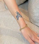 Melanie Martial Tattoo on left hand