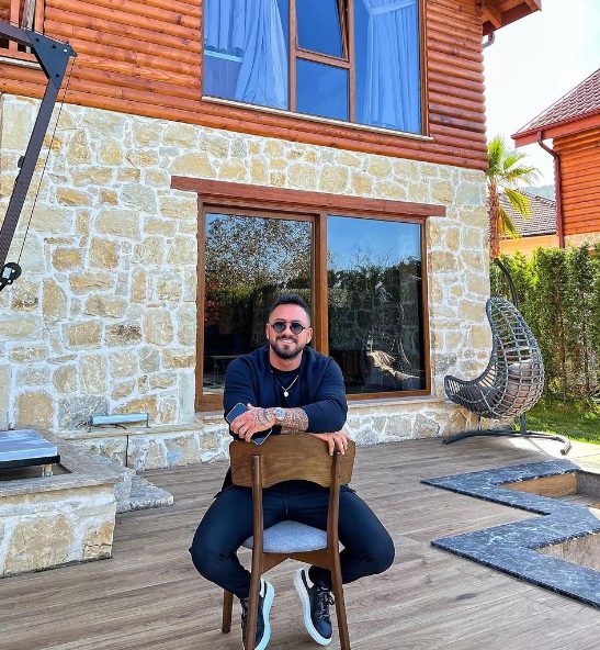 Gökhan Çıra with his house
