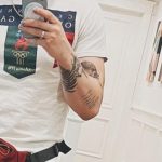 Julien Solomita's left hand tattoos