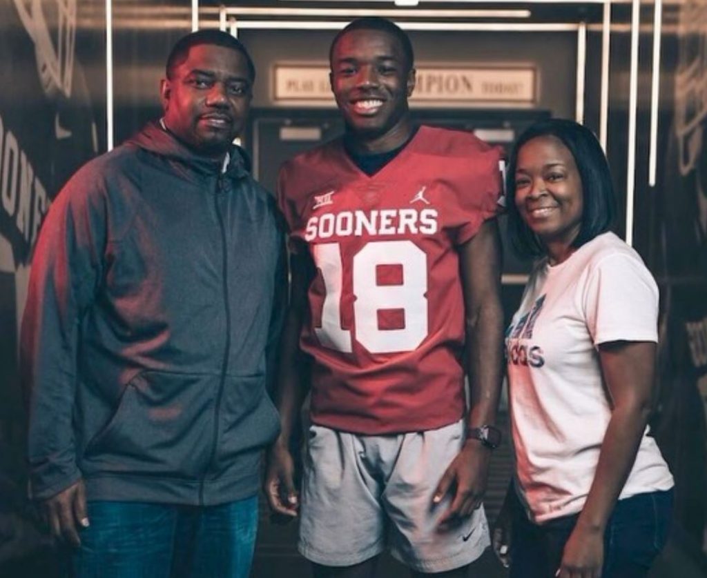 Marvin Mims Jr with his parents