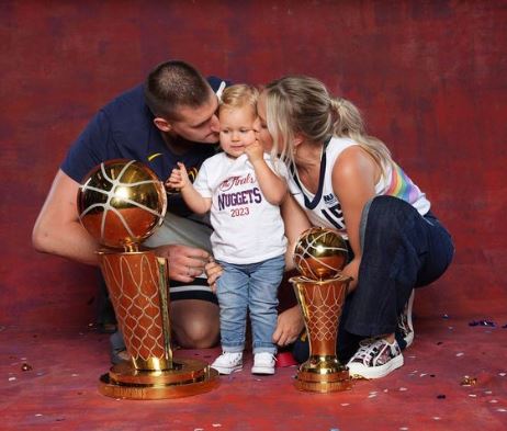 Nikola Jokic with his daughter and wife